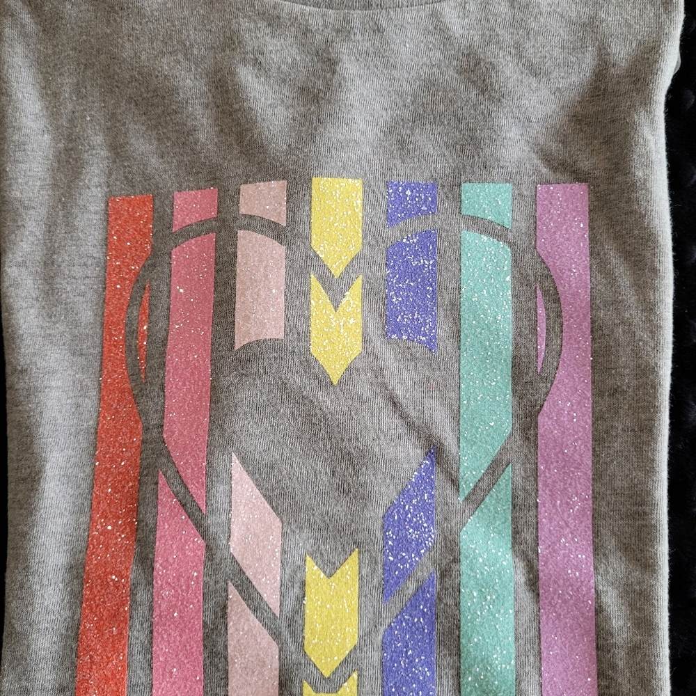 A girl's Gray t shirt with a heart and glitter